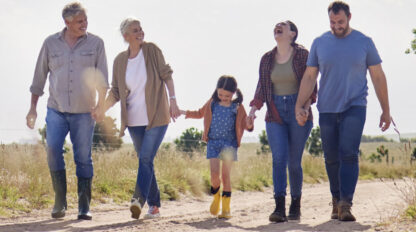 Shot of a multi-generational family walking together on a farm stock photo