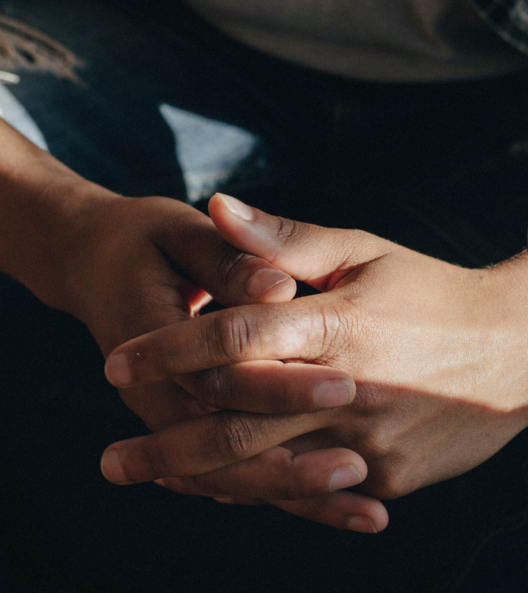 man holding his hands together